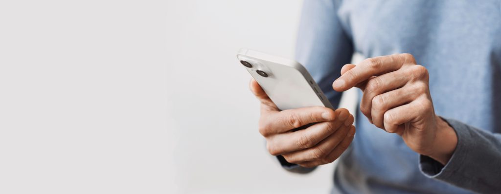 Male  hands holding  phone. Technology, mobile apps, social networks, communication, staying connected, modern lifestyle concept