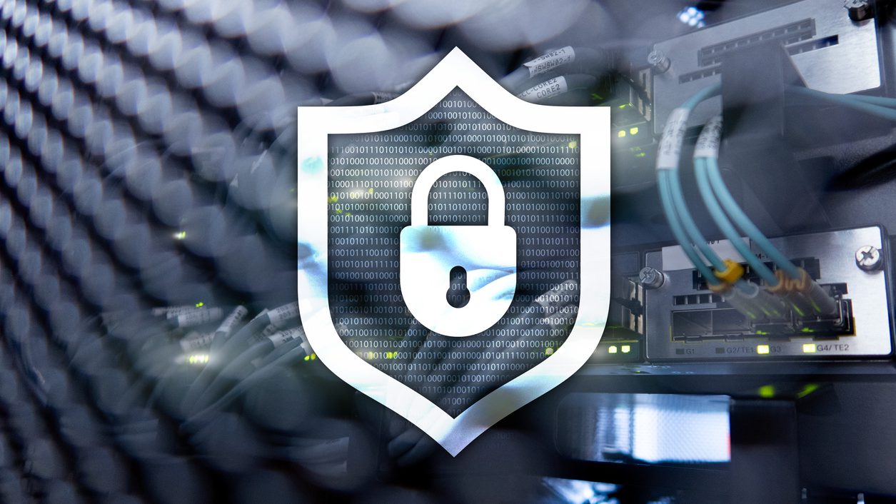 Cyber protection shield icon on server room background. Information Security and virus detection.