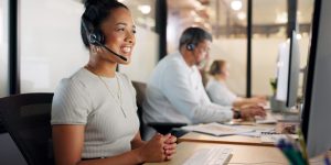 Contact us, telemarketing and crm, black woman in customer service with headset and smile on face. Happy to help, call center agent or sales consultant on phone call, support and consulting online.