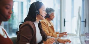 Woman, call centre and headphone for help in office, telemarketing or customer service of client online sales support. Female agent, offer advice and talk, telecom or solution by virtual guide