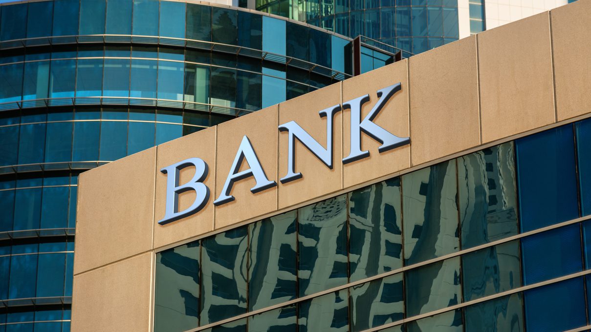 Bank sign on glass wall of business center